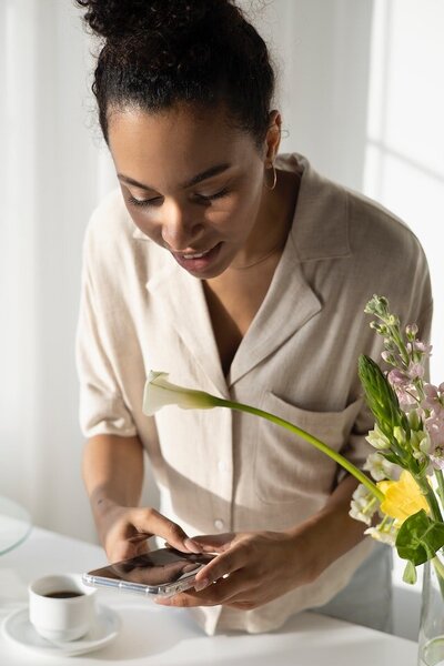 Woman taking picture with her cell phone