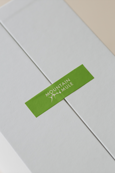Mountain Mule Tape White on Green Mockup for Client Gifts
