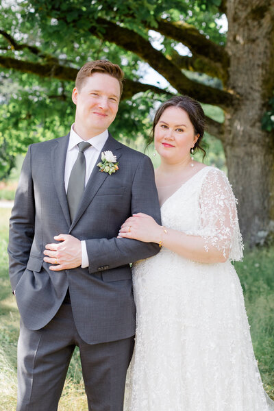 Bride and groom on a balcony outside in vancouver, canada
