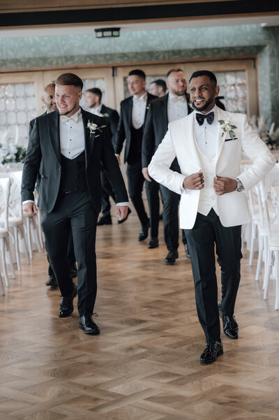 groomsmen in black tie on way to ceremony