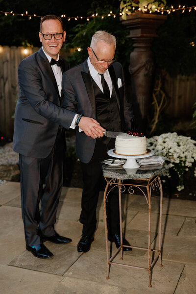 Married couple cutting their cake at a wedding