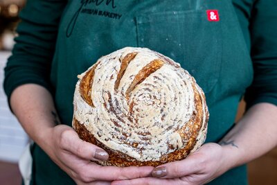 Crusty gluten-free sourdough loaf freshly baked at Grain Artisan Bakery in Snohomish, WA — made with care, local ingredients, and naturally fermented flavor.