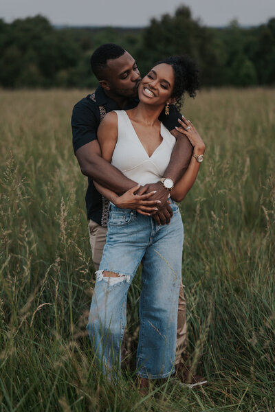 engaged couple embracing eachother