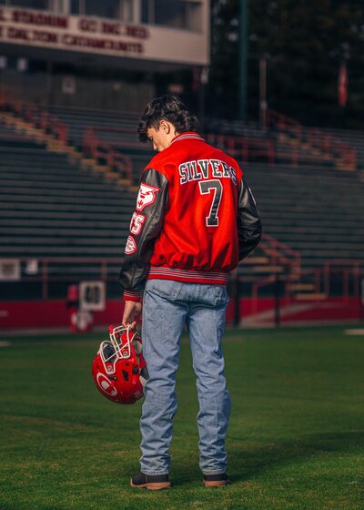 Senior Athlete with Football Jacket