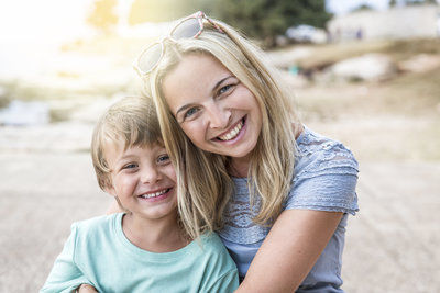 Woman Smiling with Son | Annapolis Orthodontics
