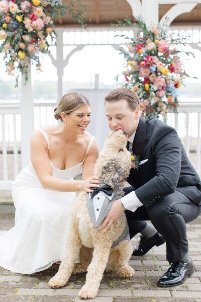 A bride and groom embracing each other as they