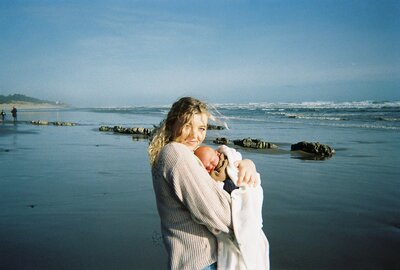 woman holding baby's breath in front of belly