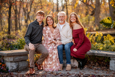 A brother and sister holding each other during a family photography session at Cliff Cave park in St. Louis.