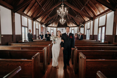 bride and groom at beaches museum and chapel