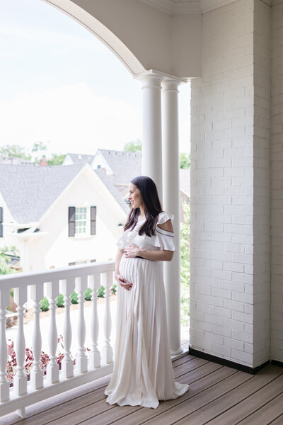 Luxurious maternity session with mom in floor length gown for maternity session