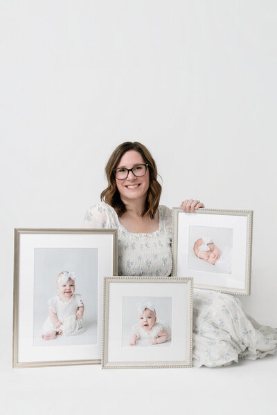 Tiffany Bradley, Savannah photographers, holding framed heirloom portrait