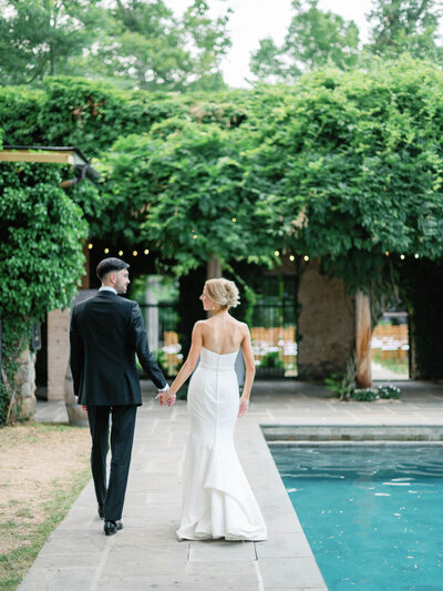 bride and groom posing during sunset