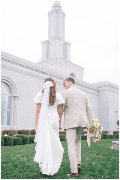 Sacramento Wedding Videographer captures couple playing in water during engagement photos