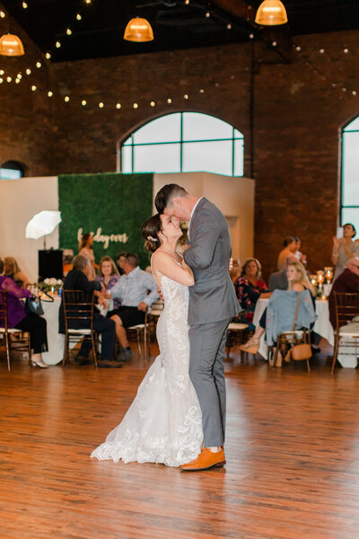 groom dipping bride