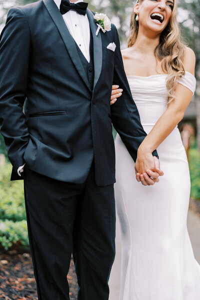couple standing in a grass field