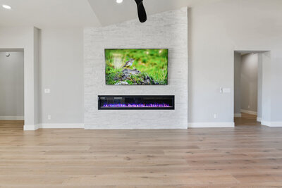 stacked stone by MSI, electric fireplace by Amantii, Engineered hardwood floors.