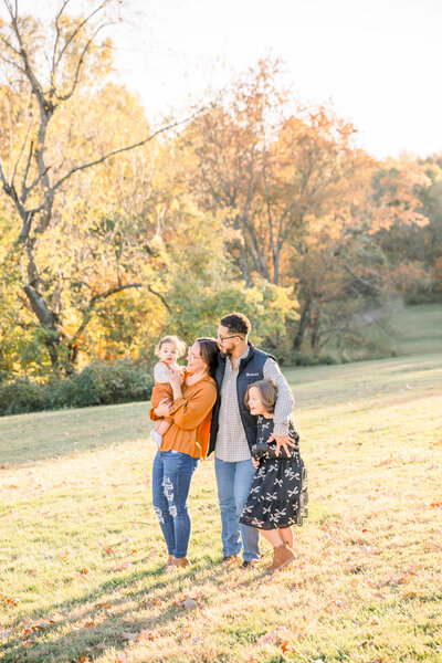 family photos taken in a park during golden hour