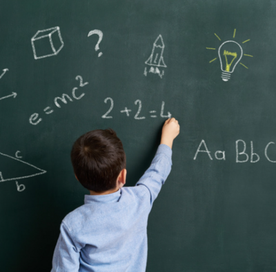Education Child writing on blackboard;