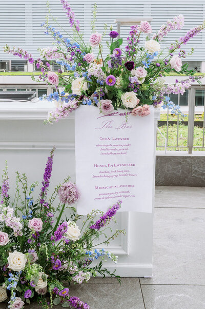 Custom wedding linen bar sign with romantic modern design on clean look white bar with fresh colorful whimsical florals in alexandria virginia