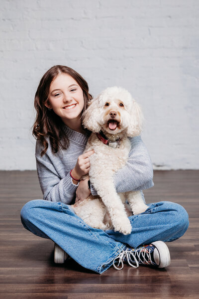 senior-girl-sitting-on-floor-with-dog