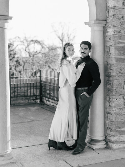 Timeless, editorial image of couple looking at camera during winter Alms Park engagement photos in Cincinnati photographed by Catholic wedding photographers Laura and Matthew