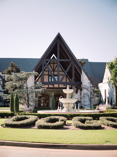 Oklahoma City Golf and Country Club entrance with a fountain