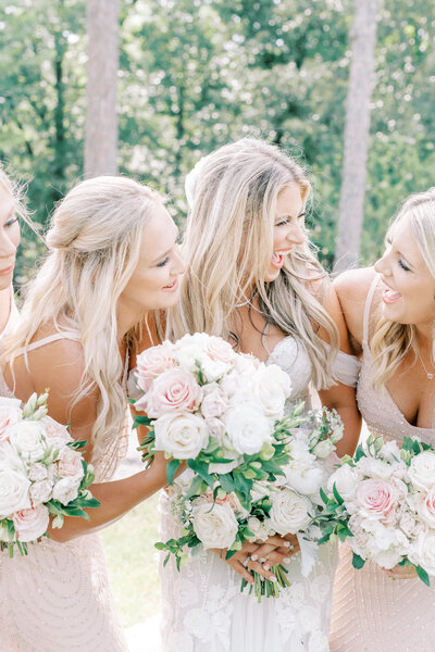 Bride and Bridesmaids laughing with each other at Houston's Venue