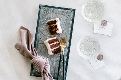 Red Velvet wedding cake flat lay with velvet napkin and cutlery