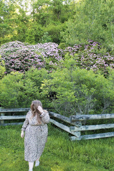 Ashleigh Henry standing with power and softness in Asheville, NC — coaching women who are healing from high-functioning survival into sacred presence.