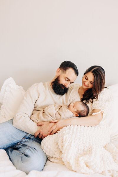couple in a studio in Houston Texas for their maternity photos