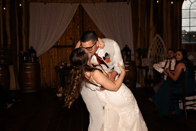 Bride and groom cutting wedding cake