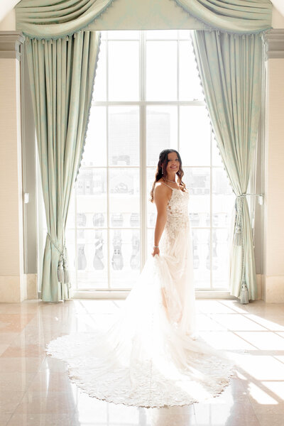 Elegant bridal portrait captured by Style & Grace Photography in St. Louis, MO, featuring the bride in a stunning lace wedding dress, highlighting her beauty and grace on her special day.