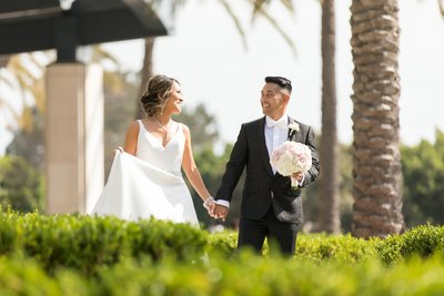 Bride and Groom walking at their wedding at the Manchester Grand Hyatt