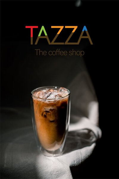 Iced coffee in a tall glass with "TAZZA The coffee shop" text overlay on a dark background.