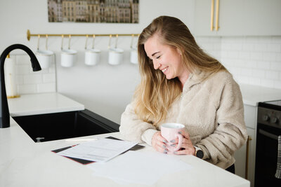 Realtor Tamara Rzan beaming as she reads through her paperwork