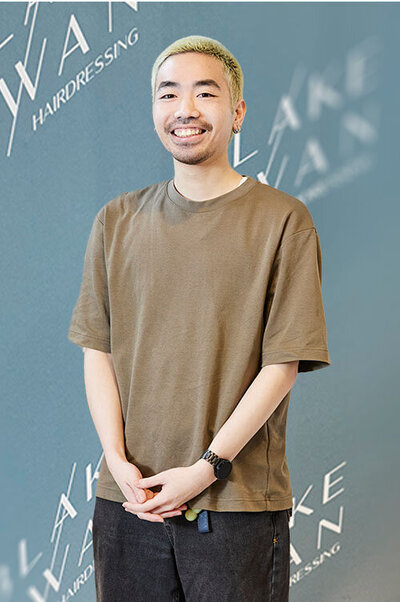 Co-owner & Men’s hairdresser with short blonde hair in casual attire, representing professional styling at Blake & Kwan Hairdressing Sydney.