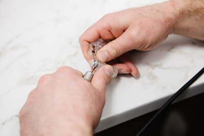 Prosthodontist creating custom-fit clear aligners for a patient at Peak Prosthodontics in Lethbridge—ensuring precise and comfortable teeth straightening. Serving Southern Alberta and surrounding areas.