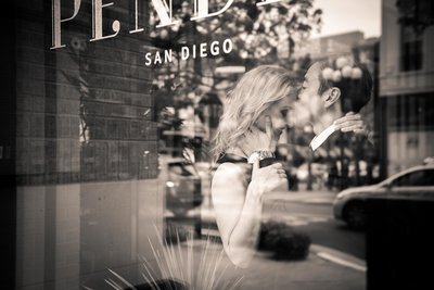 Reflection of newly engaged couple in window