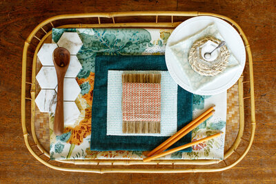 Aqua fabric selections in a wicker basket.