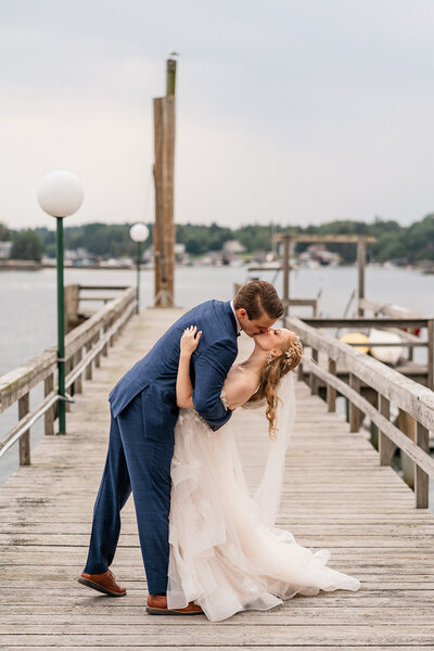 A couple during their New England Elopement on the coast of Maine, taking in the moments after just getting married.