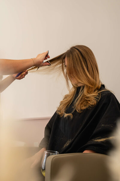Women getting hair done at salon
