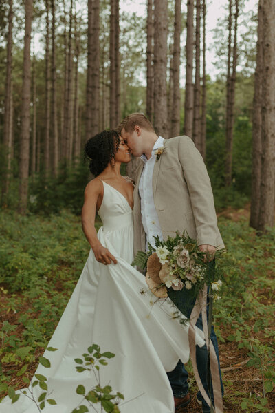 Married couple taking photo on their wedding day at Pinewood Events Center in Cambridge Minnesota
