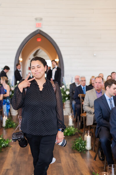 wedding photographers in dallas texas holding a professional camera