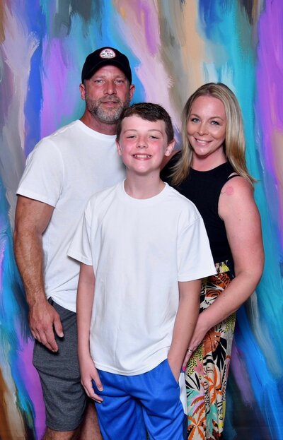 Lacey and her family in front of a Christmas tree