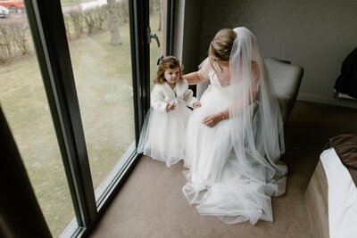 A timeless black and white photograph capturing the bride in a flowing dress, radiating elegance and grace in a luxury wedding setting.