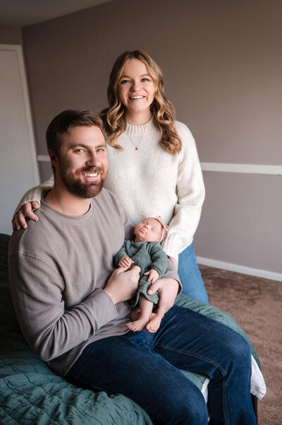 baby in a basket posing for newborn photos