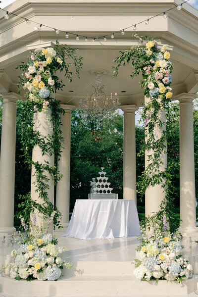 champagne tower under a gazebo decorated with florals in New Orleans
