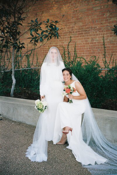 brides embracing on another