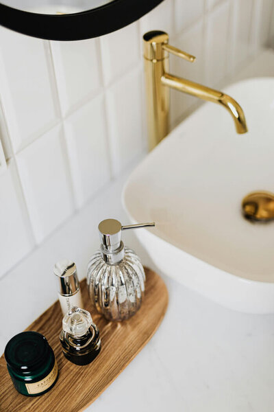Clean bathroom sink and soap dispenser