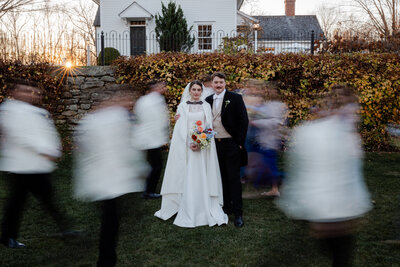 Slow shutter photograph of bride and groom with wedding party at smith farm gardens.